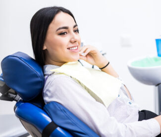 girl sitting on dental chair