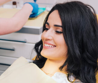 Sweet girl is in dental clinic and smiling