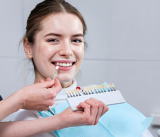 girl getting dental veneers treatment in dental clinic