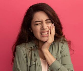 Girl suffering from serverly toothache