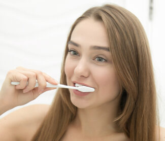 Girl brushing her teeth